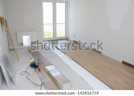 Empty room with laminate floor installation