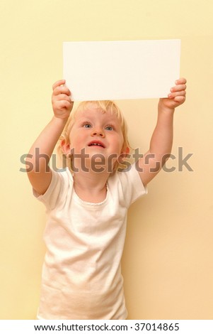 Little child holding blank placard