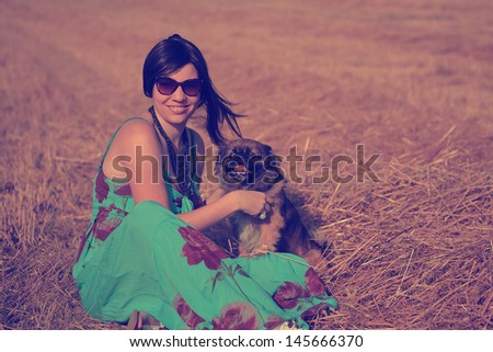 Vintage photo of young woman and pekingese dog