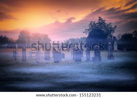 Spooky graveyard and fog