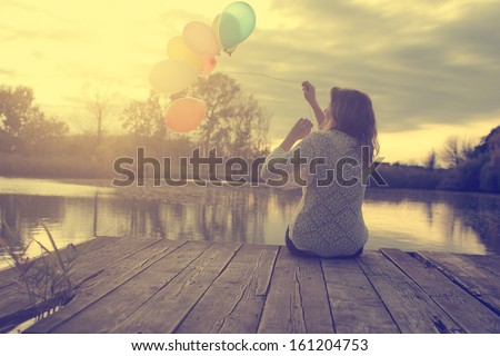 Vintage Photo Of Young Woman With Balloons