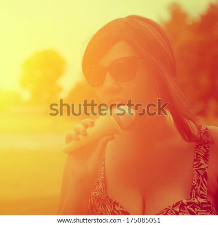 Retro photo of woman eat ice cream