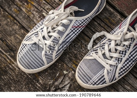 Retro shoes on wooden background