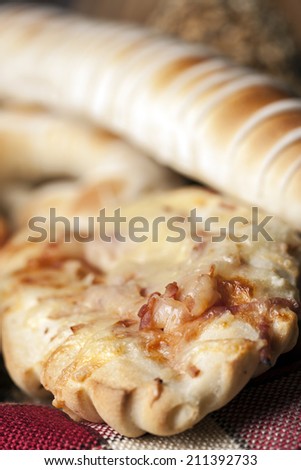 Pizza roll filled with cheese,garlic,oregano,ham