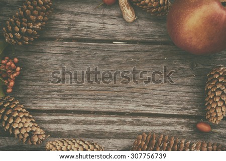 Autumn background on wooden desk. Vintage filtered photo.