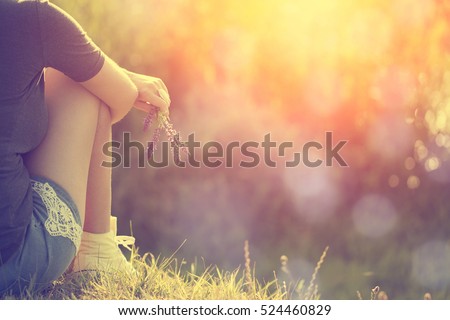 Relaxing woman at nature in sunset