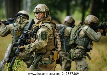 team of soldiers engaged in the exploration of the forest