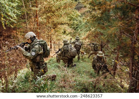 a group of military intelligence in the woods leads