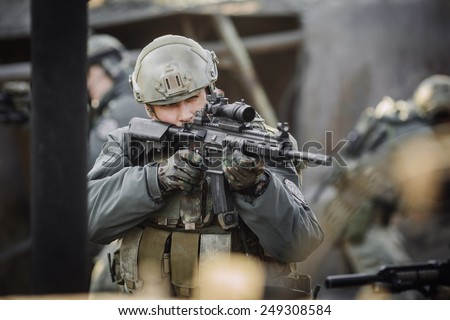 military ranger shooting an assault rifle