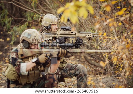 Rangers team aiming at a target of weapons