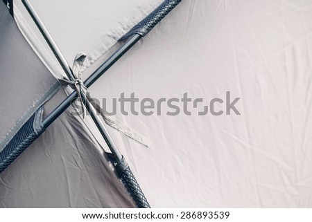 Grey tourist big tent in summer forest