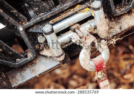 dirty hook winch bumper atv in the forest