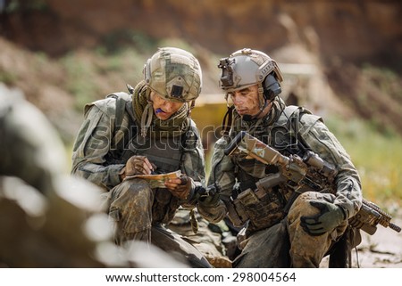 two rangers on the Outdoor of looking at the map