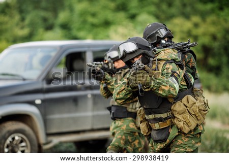 Russian special forces operators in uniform and bulletproof vest and helmets
