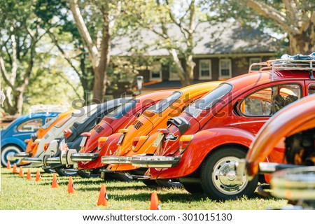 NYC, USA - AUGUST 25, 2013: Retro styled image of a row of vintage Volkswagen Beetles from the NYC Volkswagen Traffic Jam on August 25, 2013 in NYC, USA.