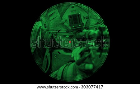 sniper during night mission/operation hostage rescue.view through the night vision scope