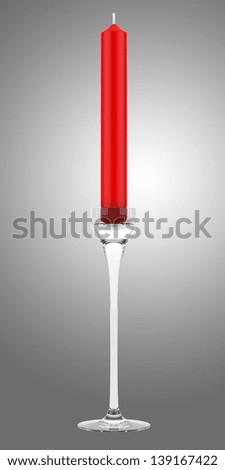 glass candlestick with red candle isolated on gray background