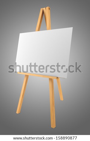 wooden easel with blank canvas isolated on gray background
