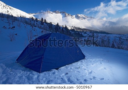 blue tent in winter mountains,outdoor,equipment