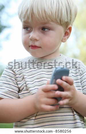 small boy with cell mobil phone children