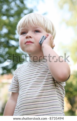 call calling boy child children outdoor connect calling cell phone carefully concentrated