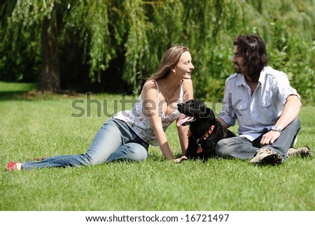 couple people with dog outdoor
