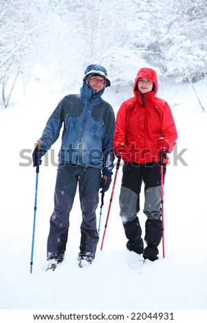 young people walk snow trekking