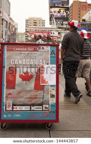 TORONTO - JULY 1, People walking to Yonge Dundas square  for Multicultural Canada Day Celebration July 1, 2013 in Toronto, Canada.