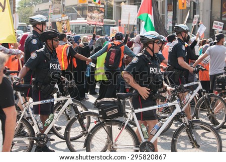 TORONTO,CANADA  JULY 11,2015:  Al Quds Day demonstration  across the street from the US Consulate General