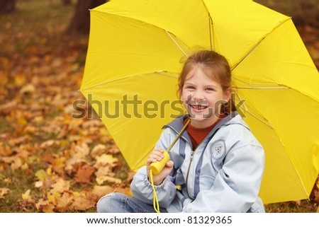 smiling girl with yellow umbrella