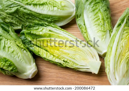 Romain lettuce on kitchen board