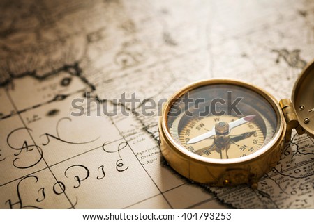 Compass on vintage map