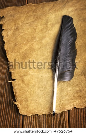 Quill on paper scroll