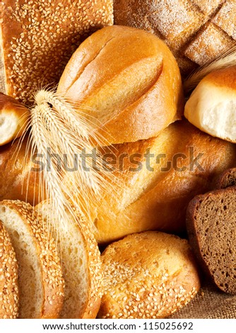Black and white bread with ears of wheat on the bag