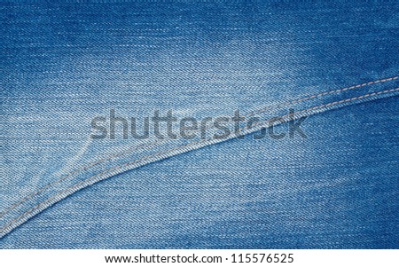 Bleached denim blue background with a seam