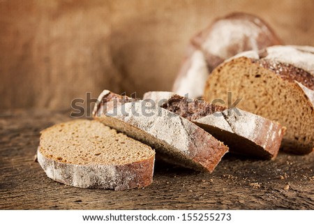 Loaf of black rye bread with sliced