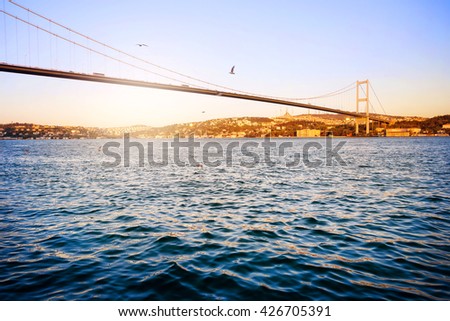 Bosphorus Bridge over the blue water at sunset. Istanbul, Turkey.