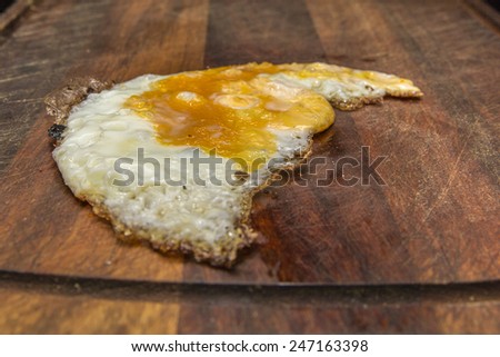 Backed egg on a cutting board