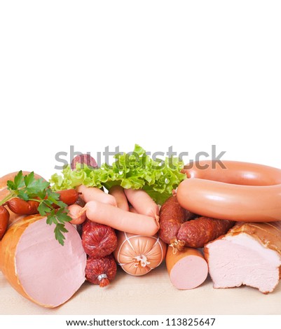 Meat and sausage . Isolated on a white background , with clipping path included