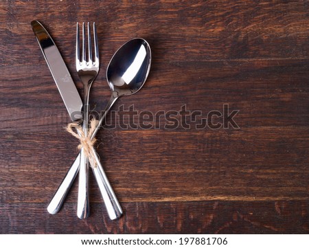 Table settings on wooden  background.