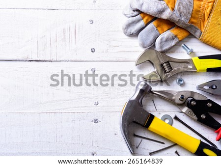 Set of tools over a wood background