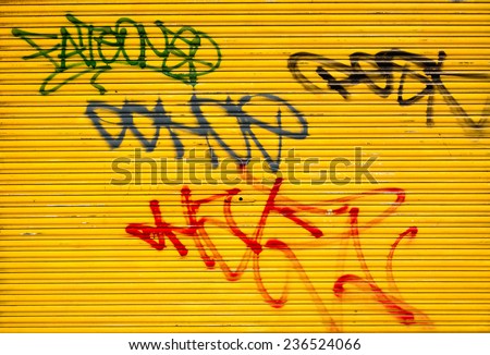 graffiti tags on a metal door