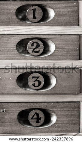 old wooden numbered museum cupboards