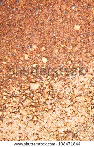 Red pebble stones and soil for background