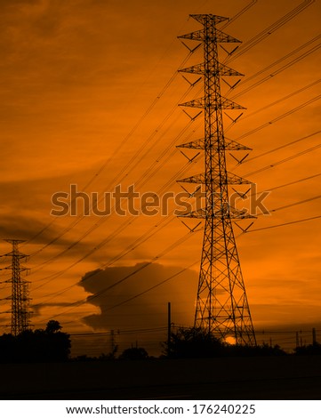 High voltage electrical power tower in silhouette