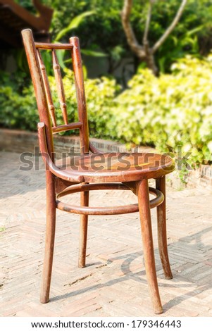 Vintage chair on floor in garden