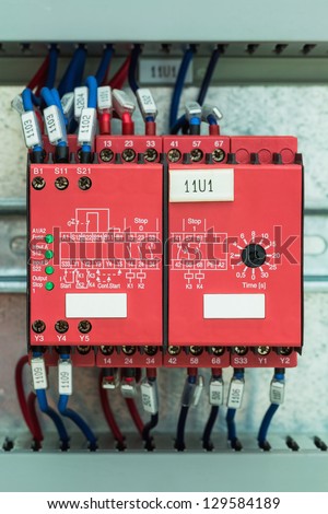 Wiring with marks on safety relays for emergency stop control in control cubicle