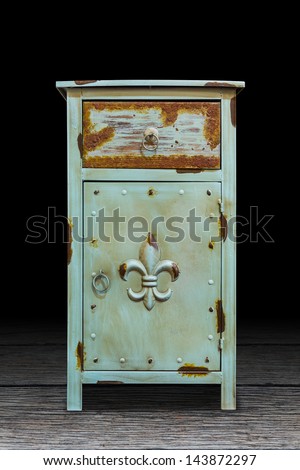 Old steel cabinet isolated on wooden plank floor, interior object, with clipping path