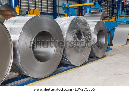 Cold rolled steel coils in storage area ready to feed to machine in metalwork manufacturing