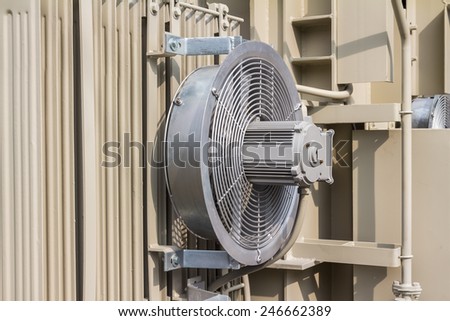 Electrical cooling fan attached to the radiator fin of the transformer